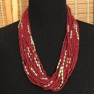 Multi-strand burgundy and gold beaded string necklace with coordinating bracelet